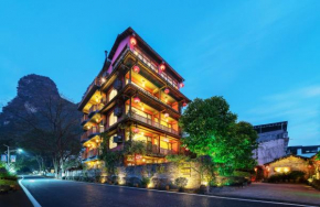 Гостиница Yangshuo Mountain Nest Boutique Hotel  Яншо